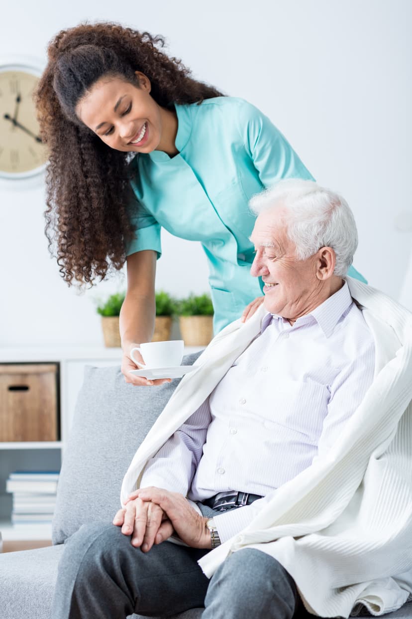 Senior sitting with caregiver
